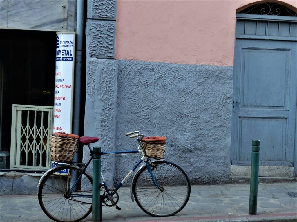 a bicycle parked on the side of a street