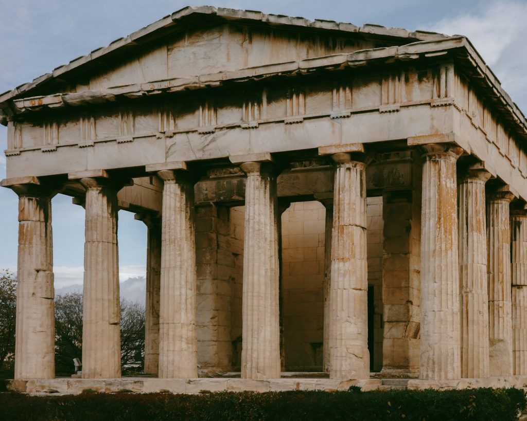 A very old building with some columns on top of it
