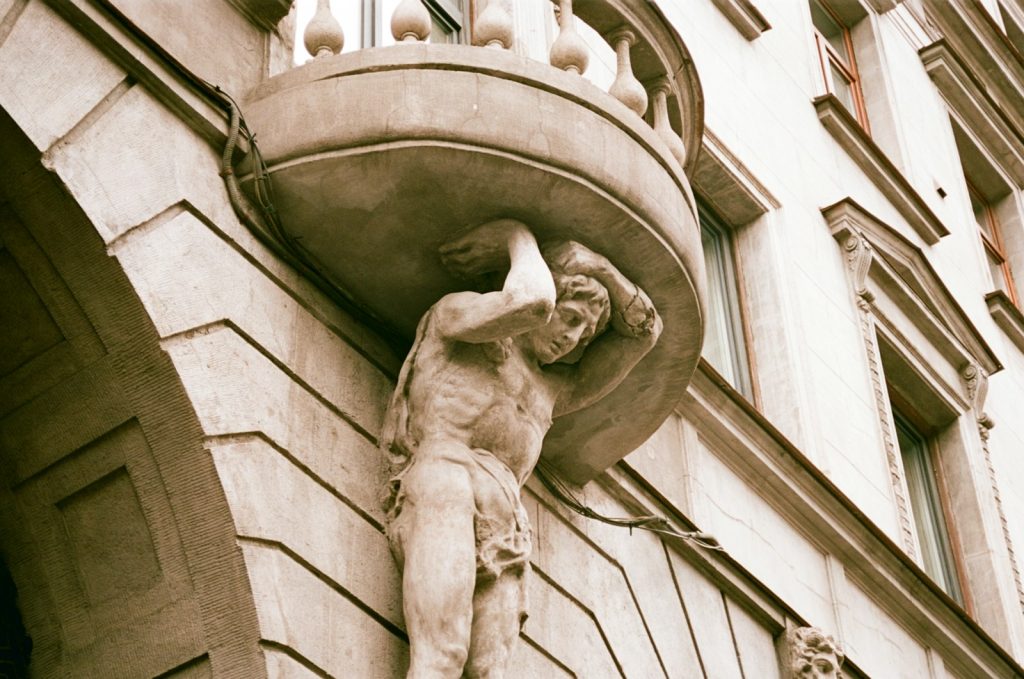 a statue on the side of a building