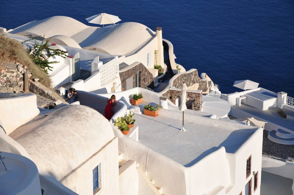 white concrete building near body of water during daytime