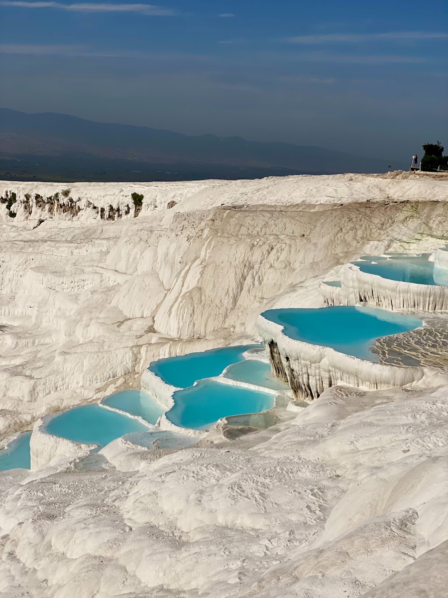A group of people standing on top of a snow covered slope